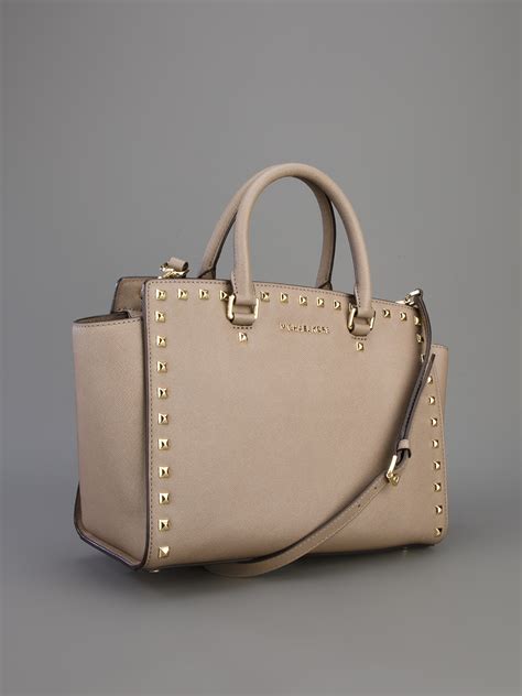 michael kors selma side hole satchel|michael kors selma bag.